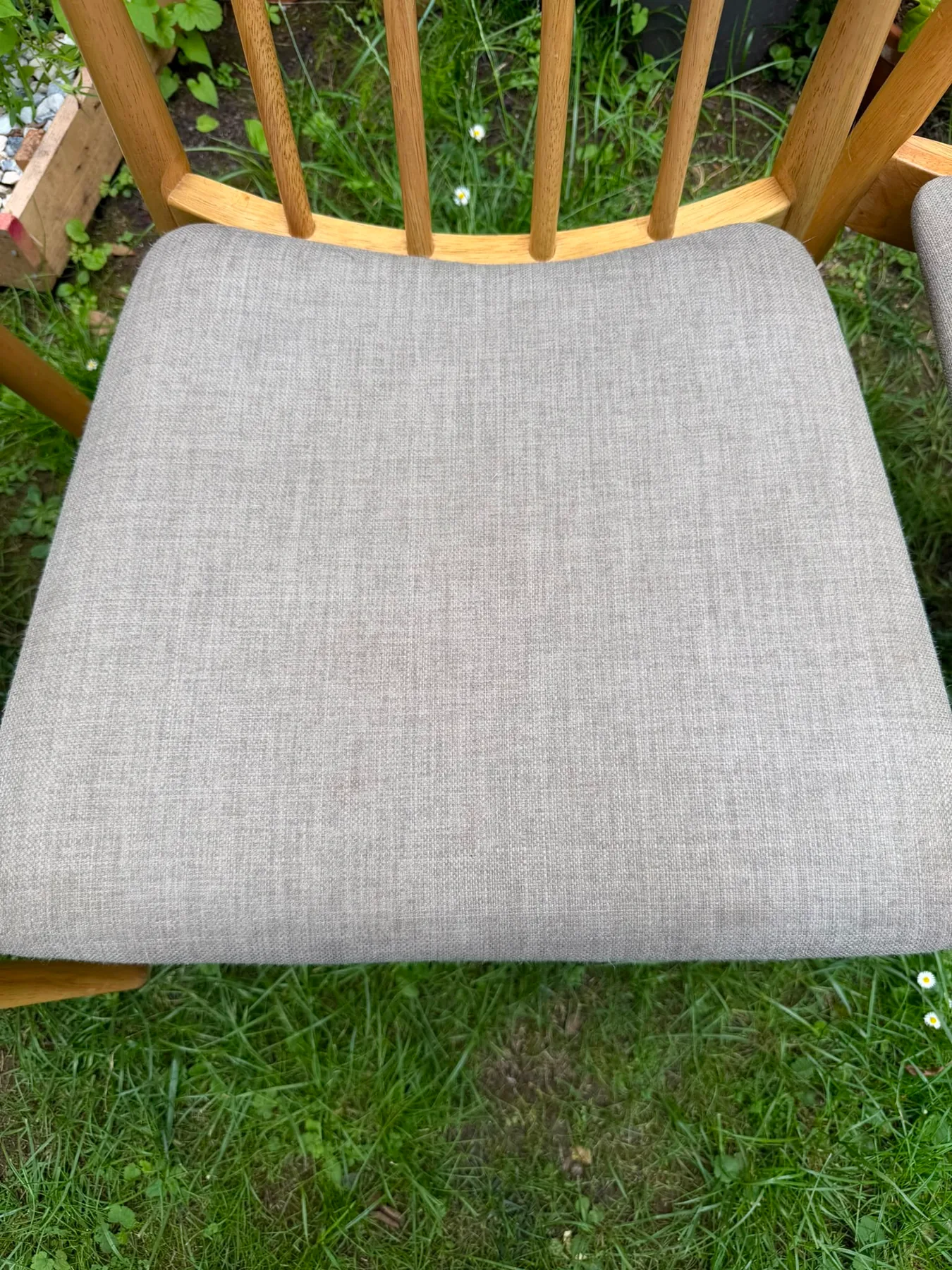 The same seat pad after cleaning, the soiling lifted and the weave back to an even oatmeal colour